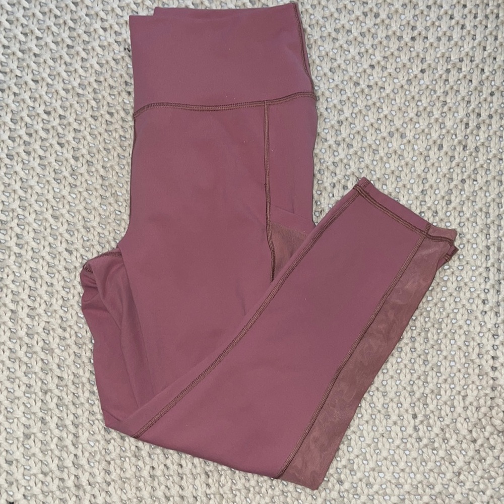 Pinkish PowerHold by Fabletics leggings with pockets
